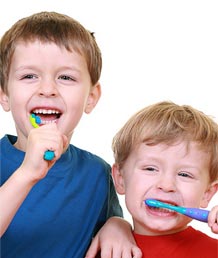 stock photo of little boys brushing their teeth